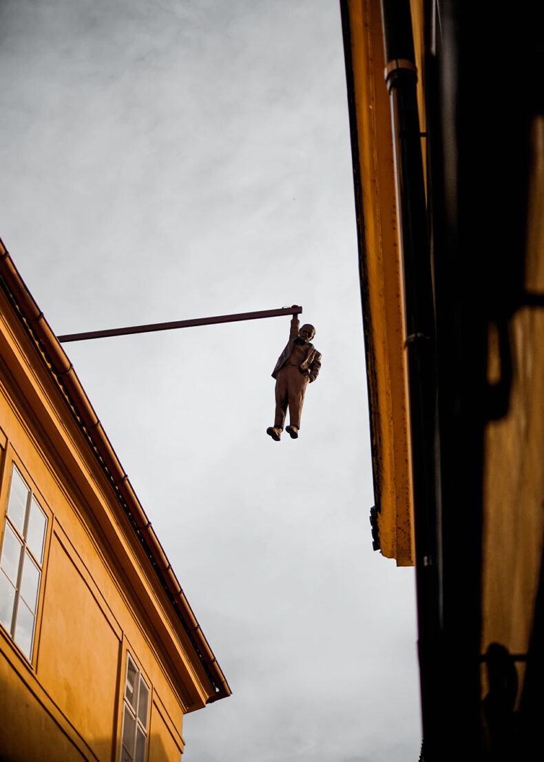 Head up while you walk through Prague - here are a few hanging sculptures