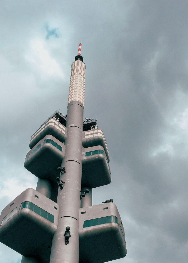 If you visit the TV tower closer, notice an artistic installation - faceless babies crawling up its side