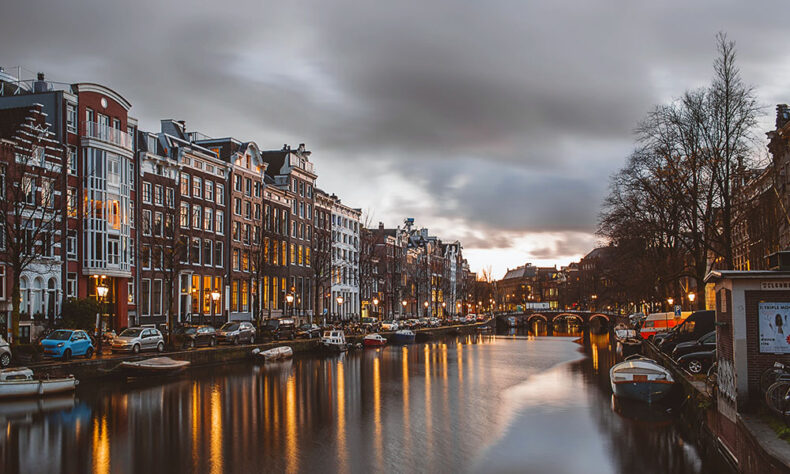 Catch the best moments in Amsterdam by walking through the lighted city