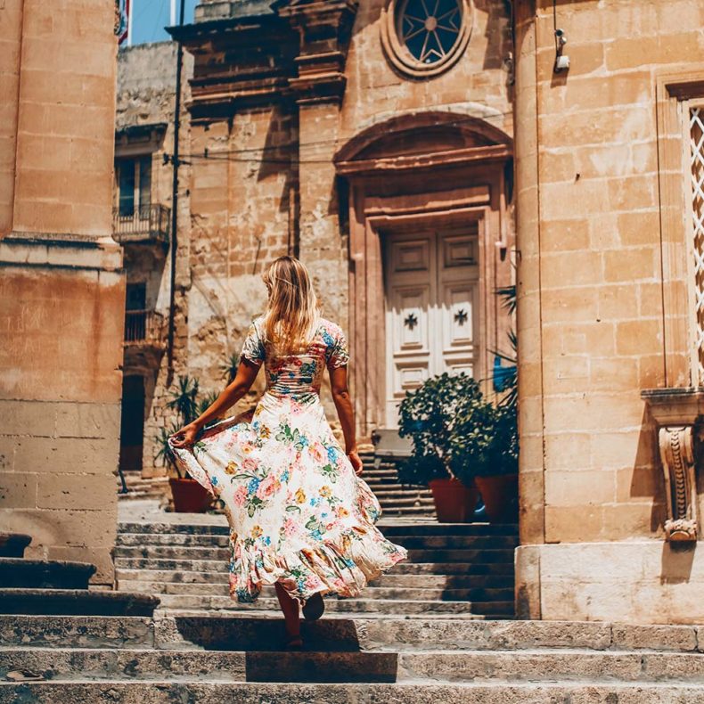 A woman walking in the oldest city of Three cities in Malta