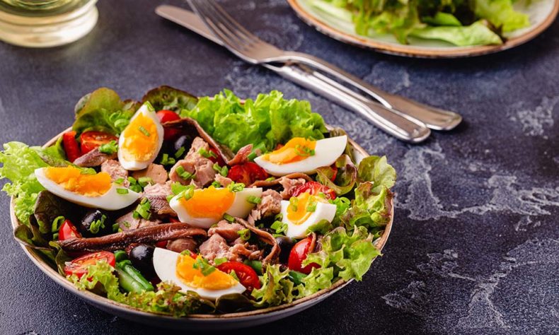 Perfect summery salad - tuna hardboiled eggs tomatoes olives anchovies