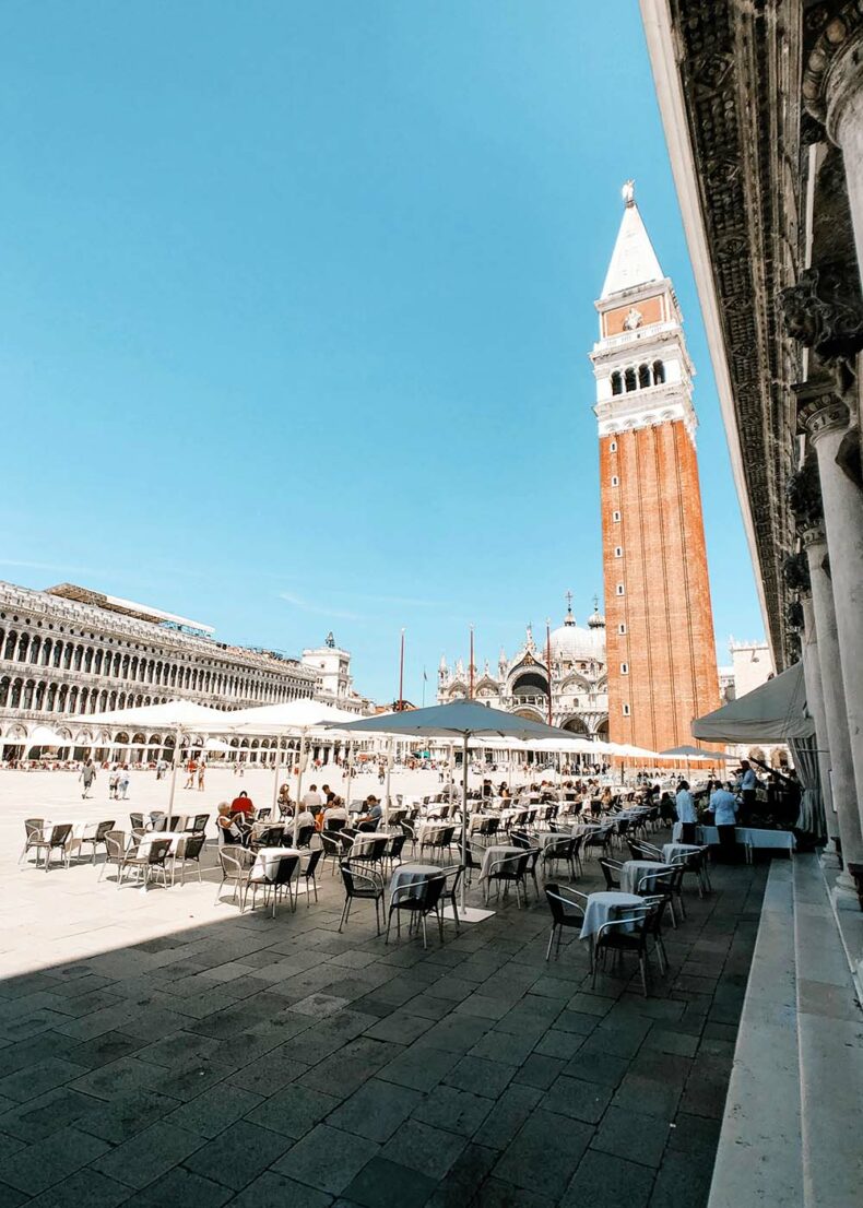 People sitting in one of the cafes in the Piazza San Marco in Venice