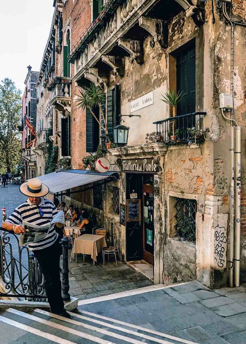 View of the everyday life in Venice - people in cafe