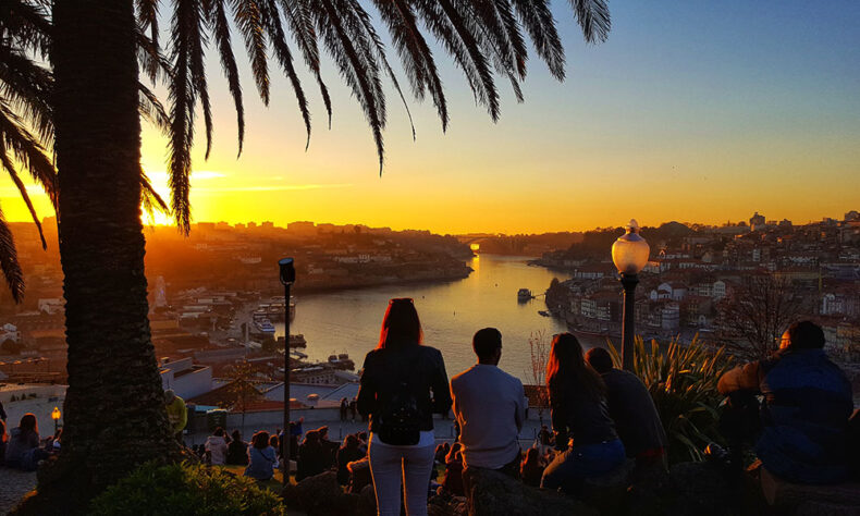 People enjoying a beautiful sunset in Porto