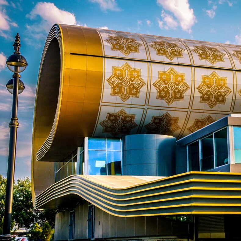 The Azerbaijan National Carpet Museum, even from the outside, looks like a rolled-up carpet