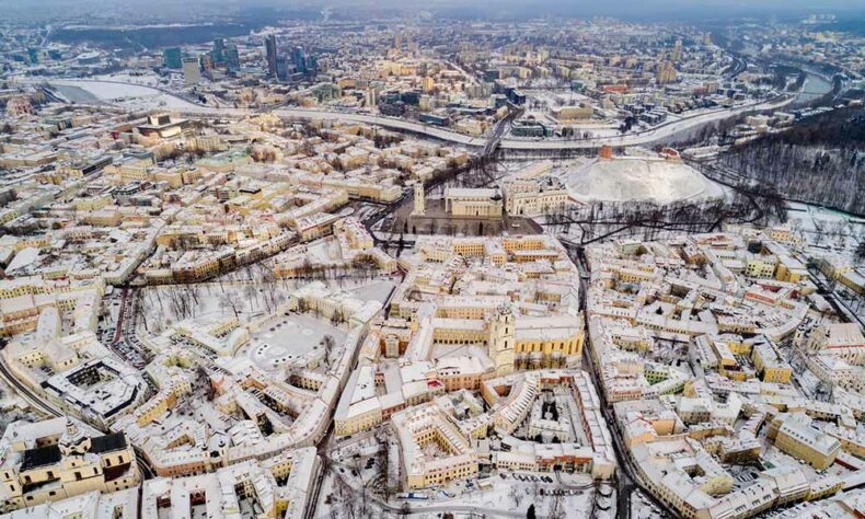 Look over the Vilnius city during a hot air balloon flight in winter