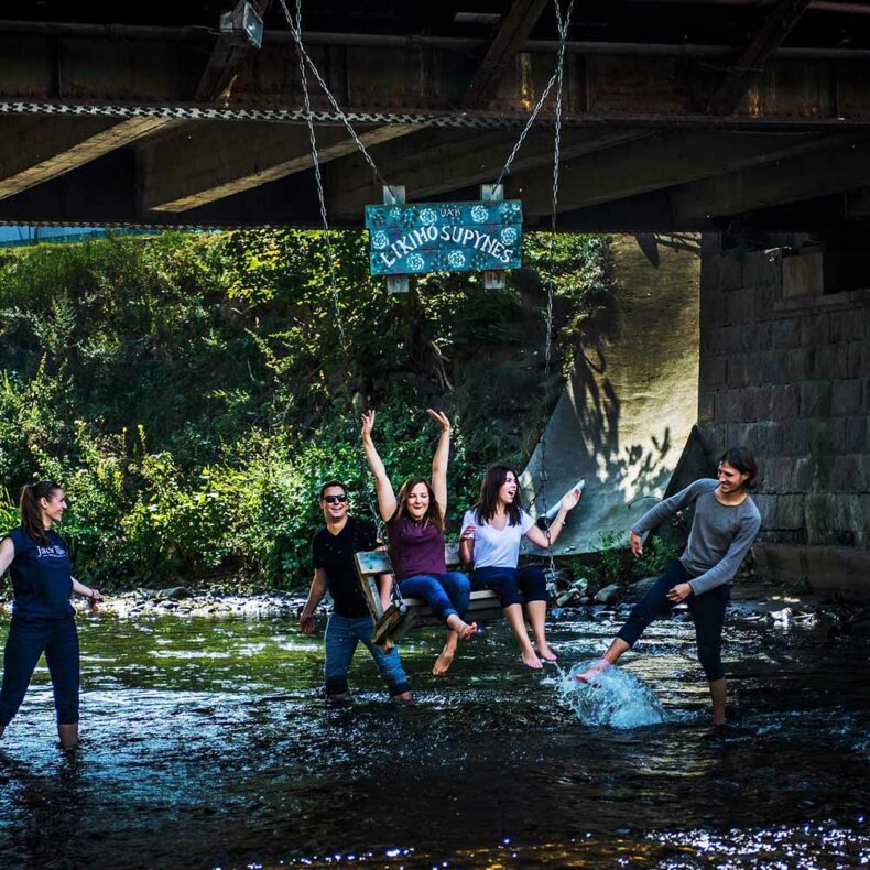 Make your way under the Užupis Bridge to have a go on the Swing