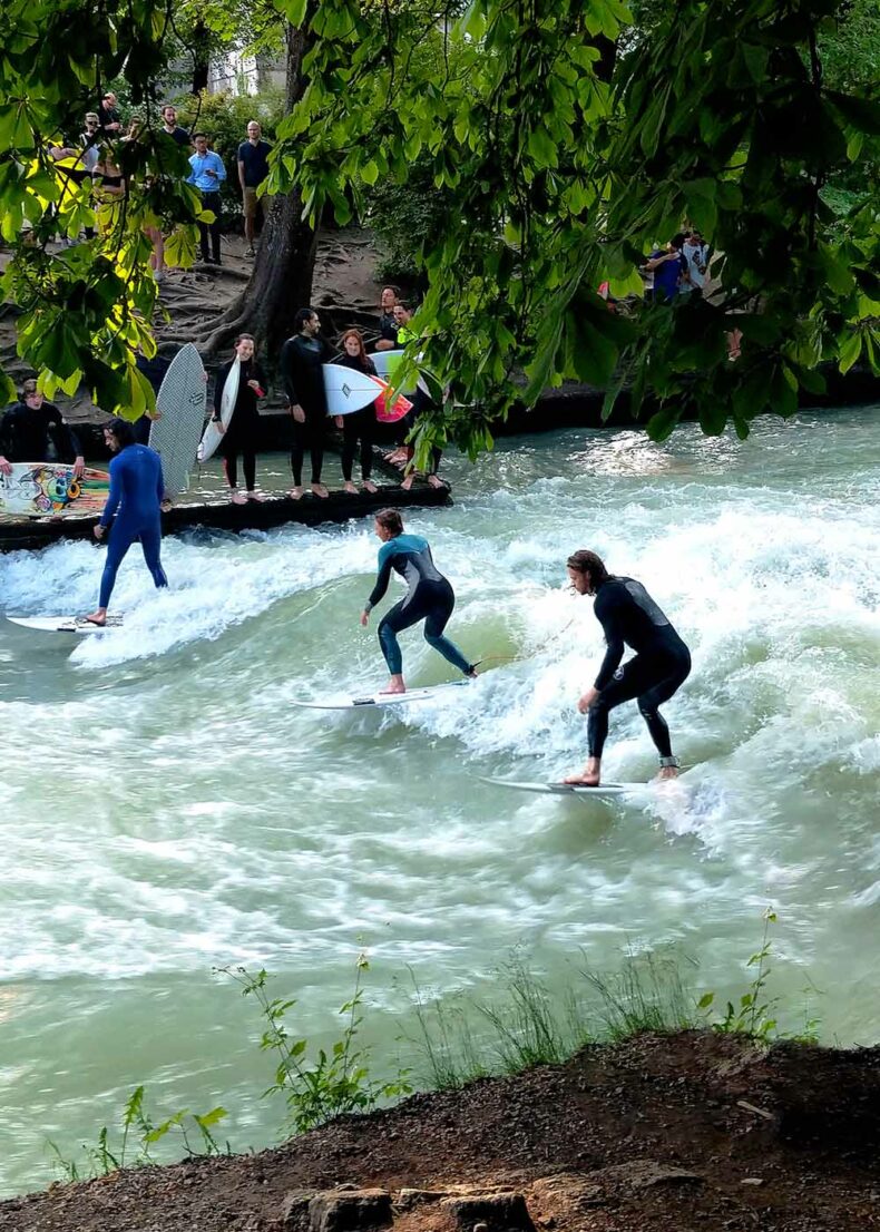 Experience surfing on the Eisbach River at the entrance of the Englischer Garten