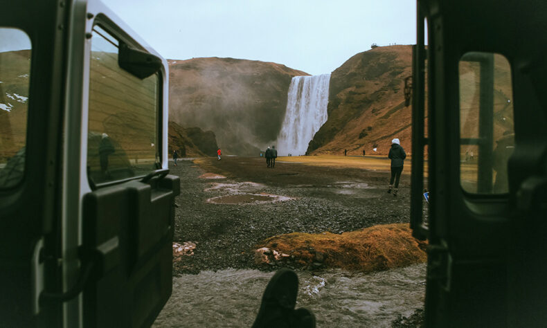 The view of Skógafoss waterfall from a car
