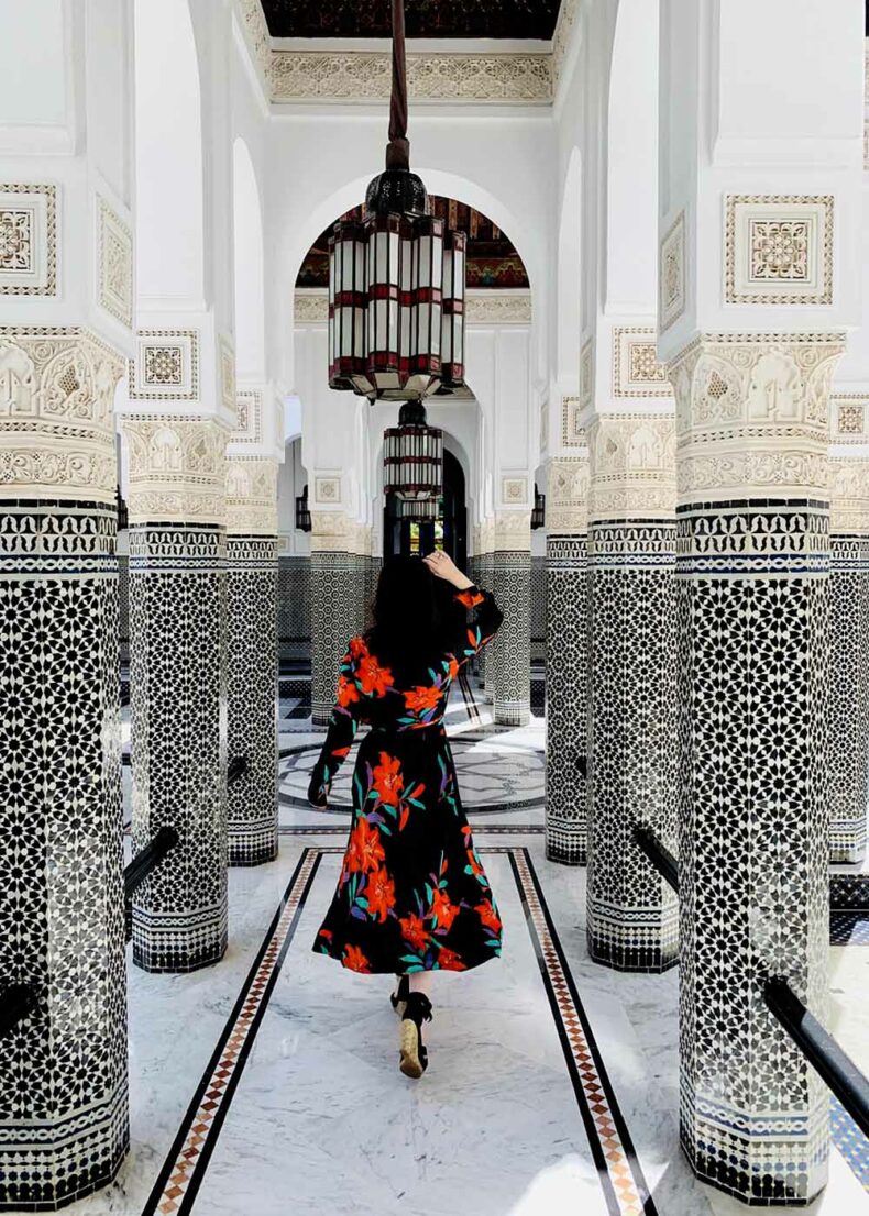 Woman walking through the luxury palace hotel La Mamounia in Marrakech