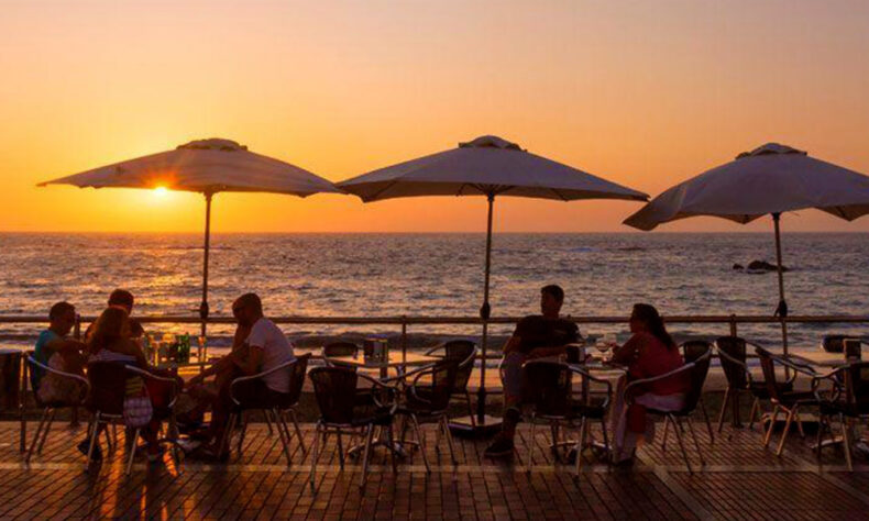 Ocean-facing terrace at Las Canteras Beach during the sunset