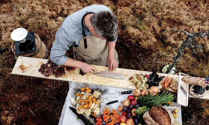 Michelin-starred Estonia's chef preparing dish in bog