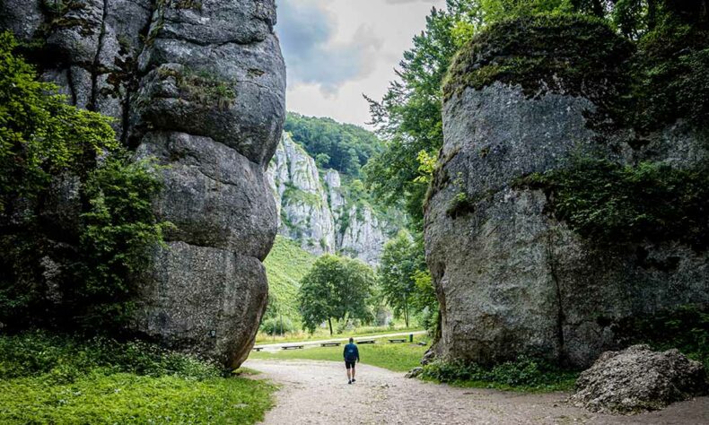 A man walking at the Ojców National Park, which is filled with unique rock formations