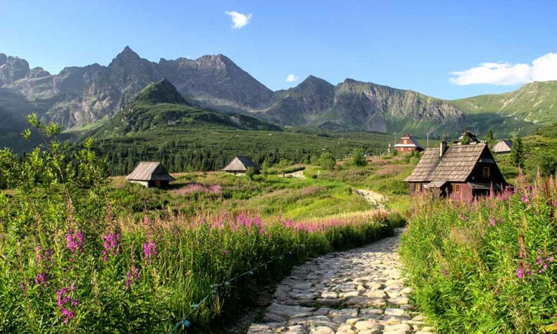 Breathtaking view of Tatra mountains and wooden houses