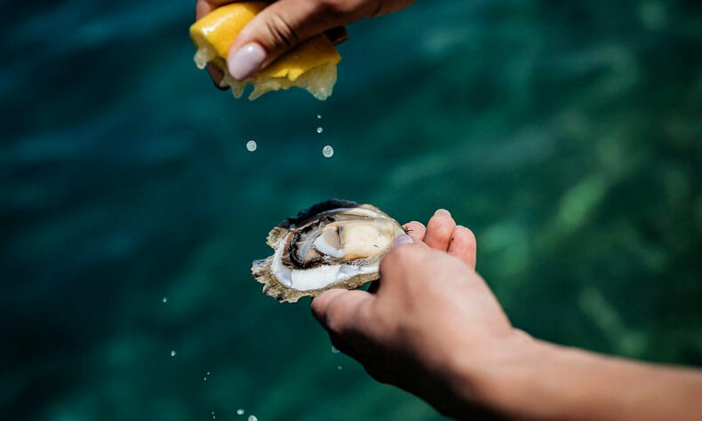 Raw Ston oysters served with a sprinkle of lemon juice