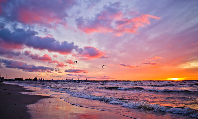 Windsurfers on Tallinn's beach during sunset time
