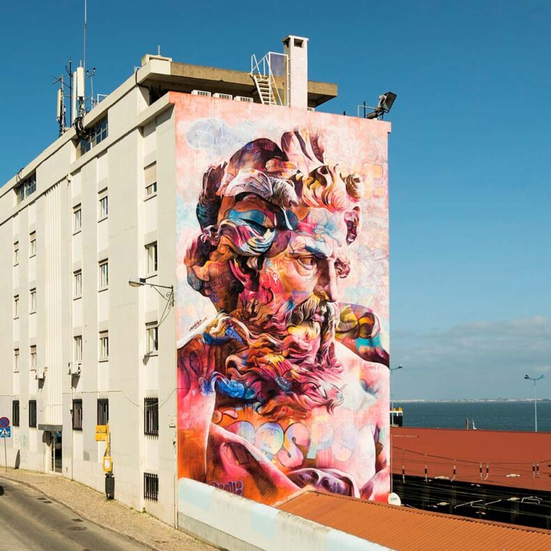 Poseidon mural by artist PichiAvo at the Alfama neighbourhood