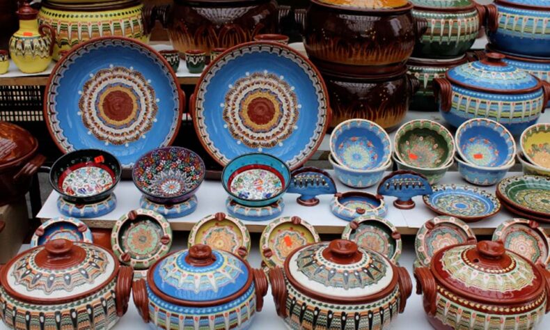 Locally crafted plates adorned with traditional folk motifs at Zhenski Pazar in Sofia