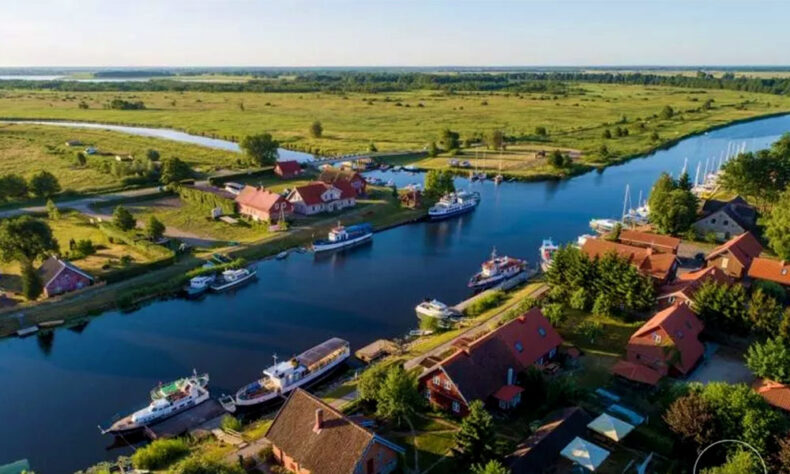 Minija village is unique with its main street - a river that unites the local fishing community