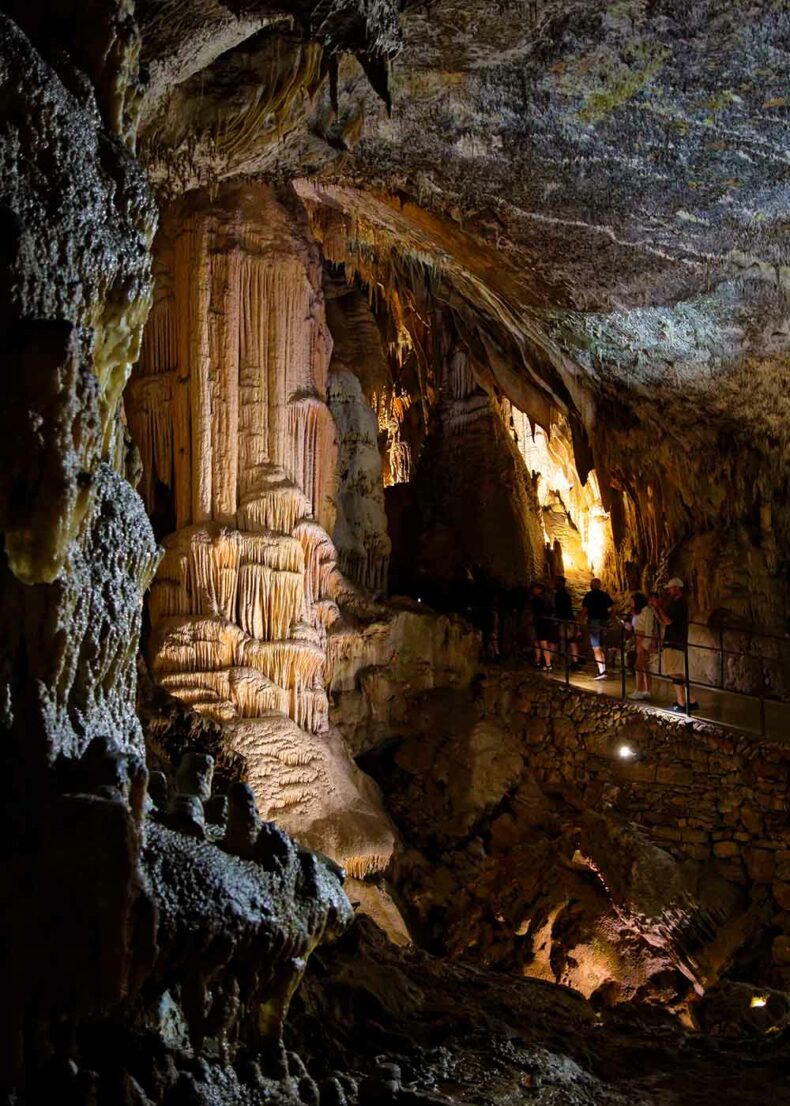 A walk at Postojna Cave that goes through cave halls and passages full of mesmerising geological formations