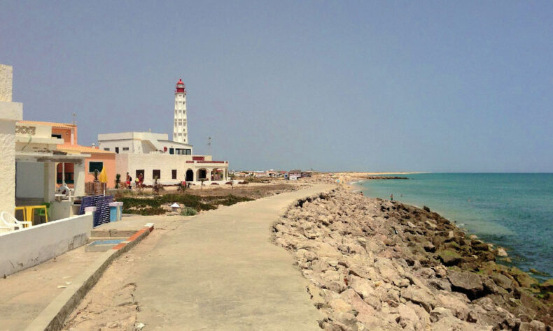 Ilha do Farol is topped by a striking 50-metre-high lighthouse painted white and red making it a postcard-perfect sight