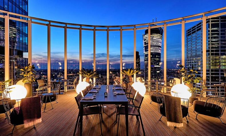 Enjoy a sunset with a cocktail in hand at the Roof Sky Bar in Warsaw