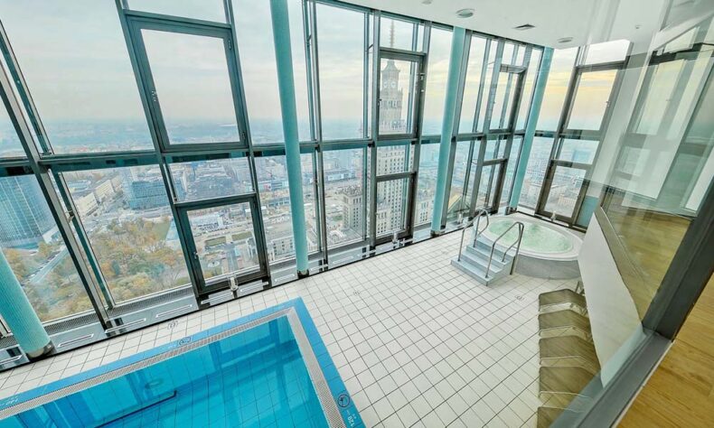 Luxury hotel InterContinental Warsaw top-floor pool which overlooks the iconic Palace of Culture and Science