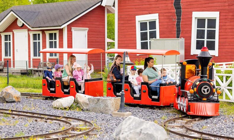 Kids enjoy the little train at the small amusement park Vauhtipuisto in Nallikari