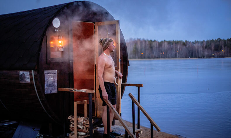 Man relaxing in Tohlopin sauna in Tampere witch is rightly known as the Sauna Capital of the World