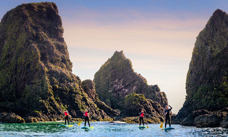 Paddleboard beneath the dramatic clifftop ruins of Dunnottar Castle