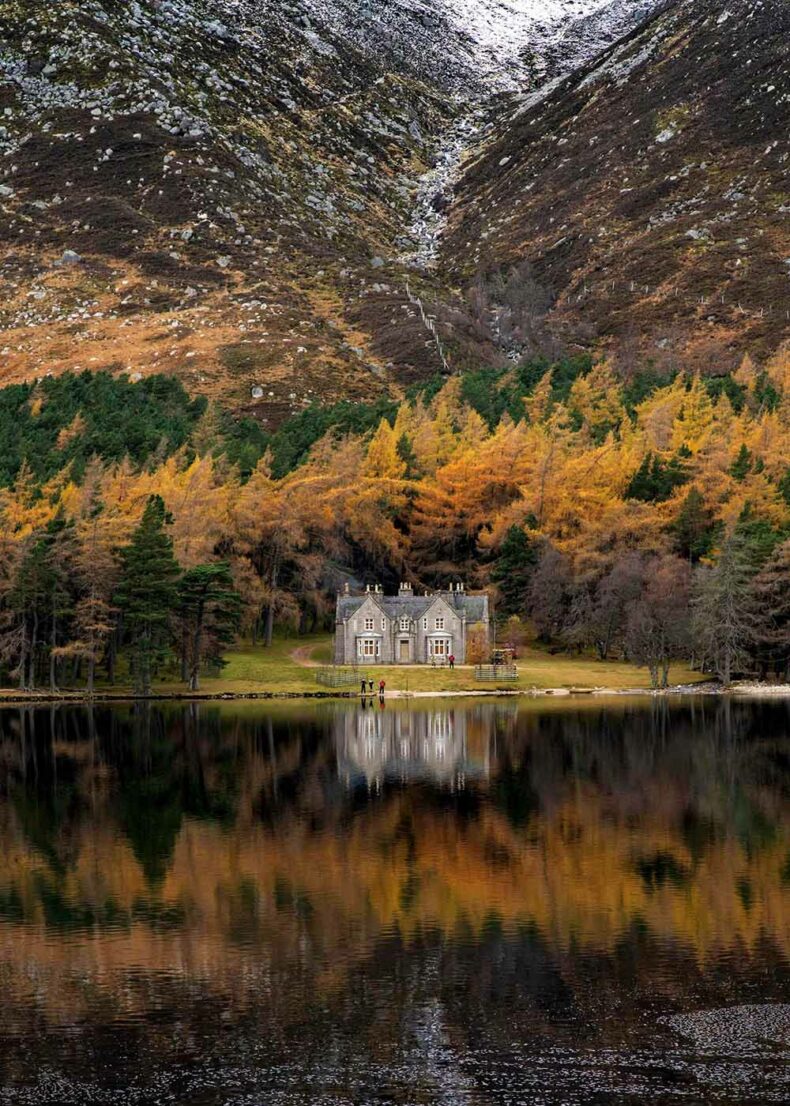 The historic Glas-allt Shiel hunting lodge standing on the shore of Loch Muick in Scotland