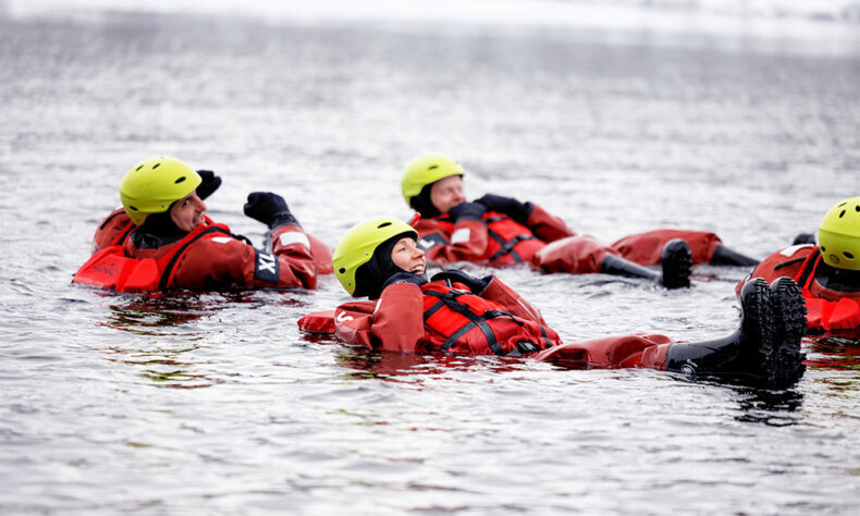 Enjoy unique experience in Kuusamo - during winter float down icy river wearing a thermal survival suit