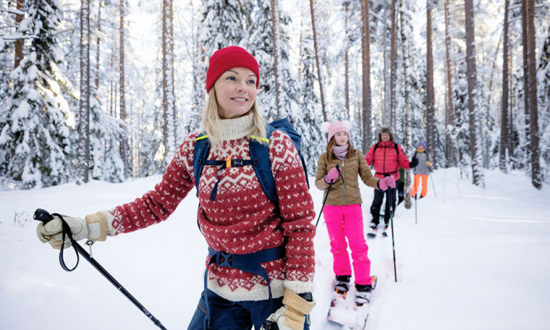 People enjoying skiing in the Oulu forest